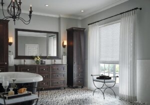 updated and upscale bathroom with sheer drapes installed on a large window birmingham