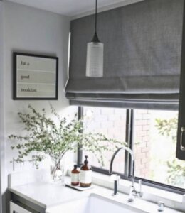 Grey Roman Shades over kitchen sink birmingham